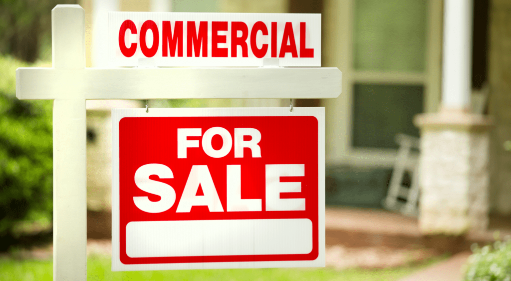 Commercial property real estate for sale sign